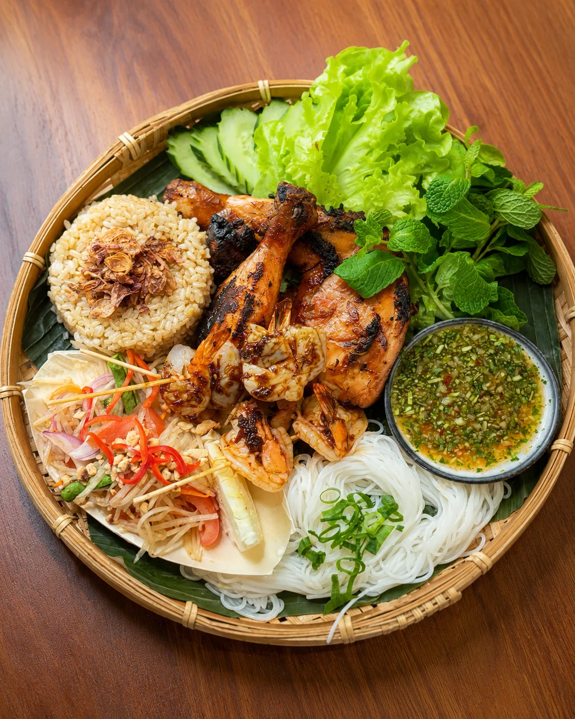 Shared Khmer grill platter arranged for a group table at ANGKOR Cambodian Flavours